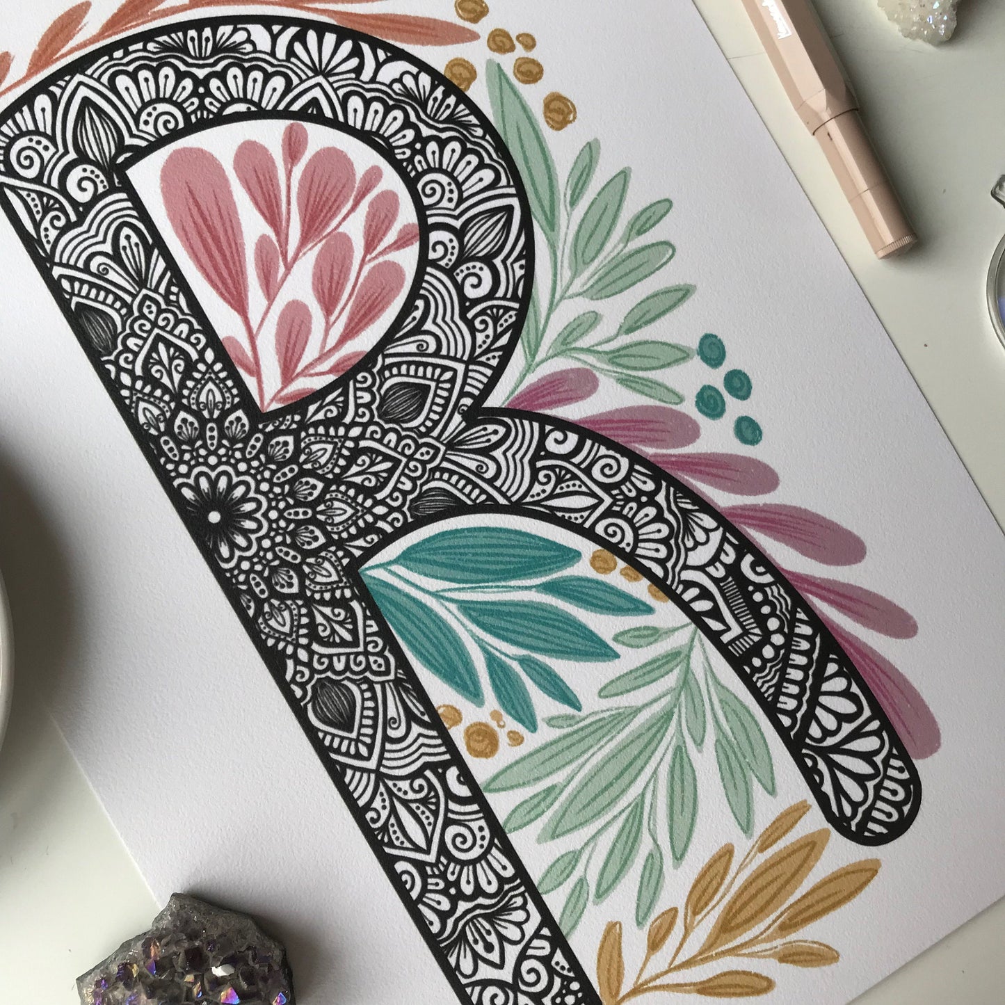 mandala R letter with plant doodle