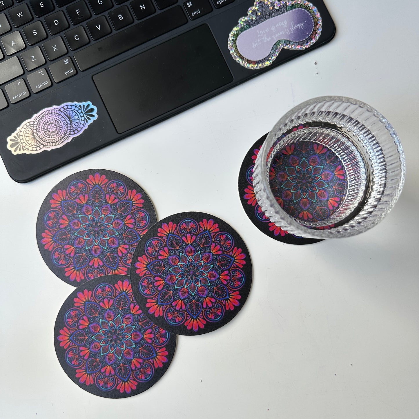 black background and colorful mandala coaster
