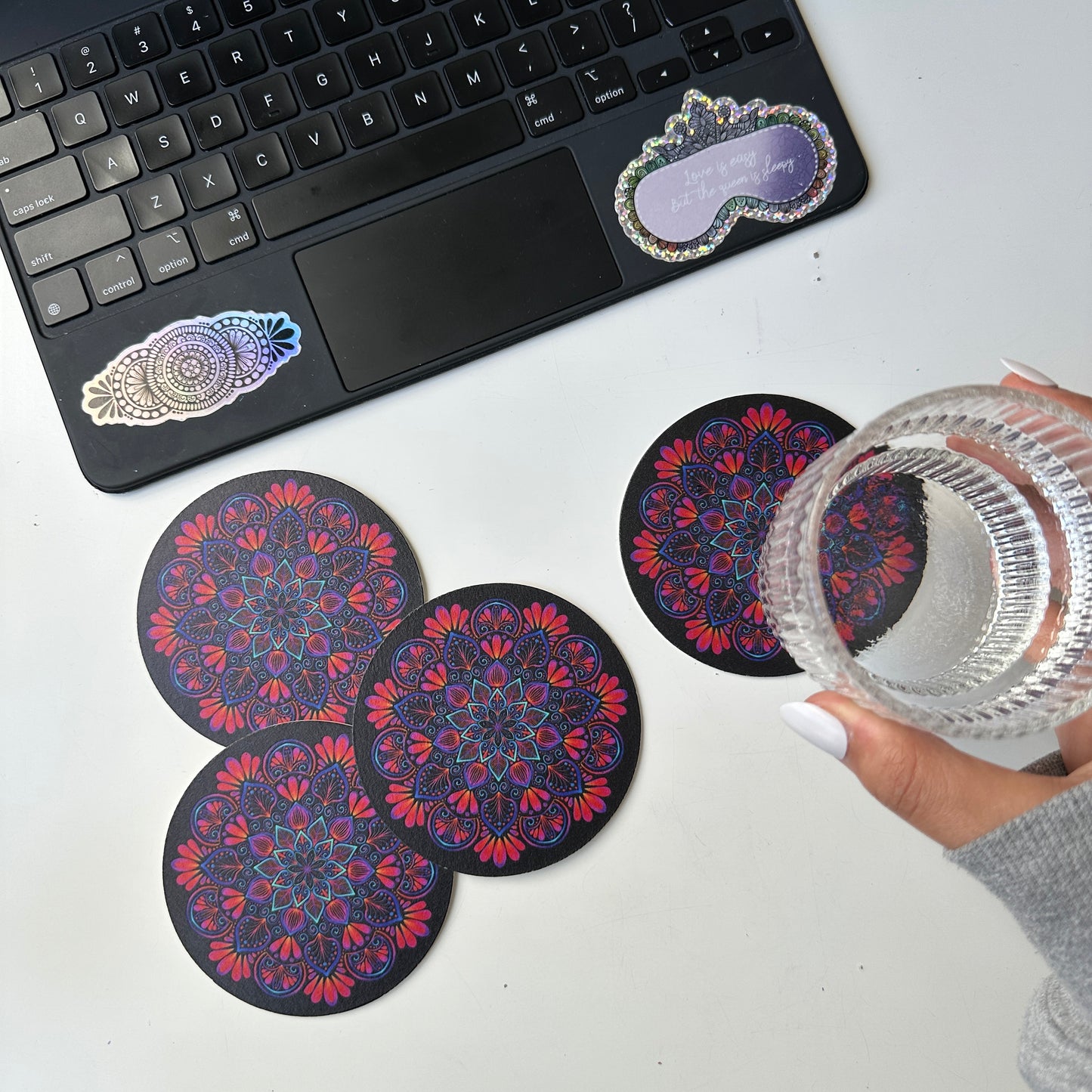 black background and colorful mandala coaster