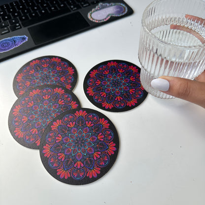 black background and colorful mandala coaster