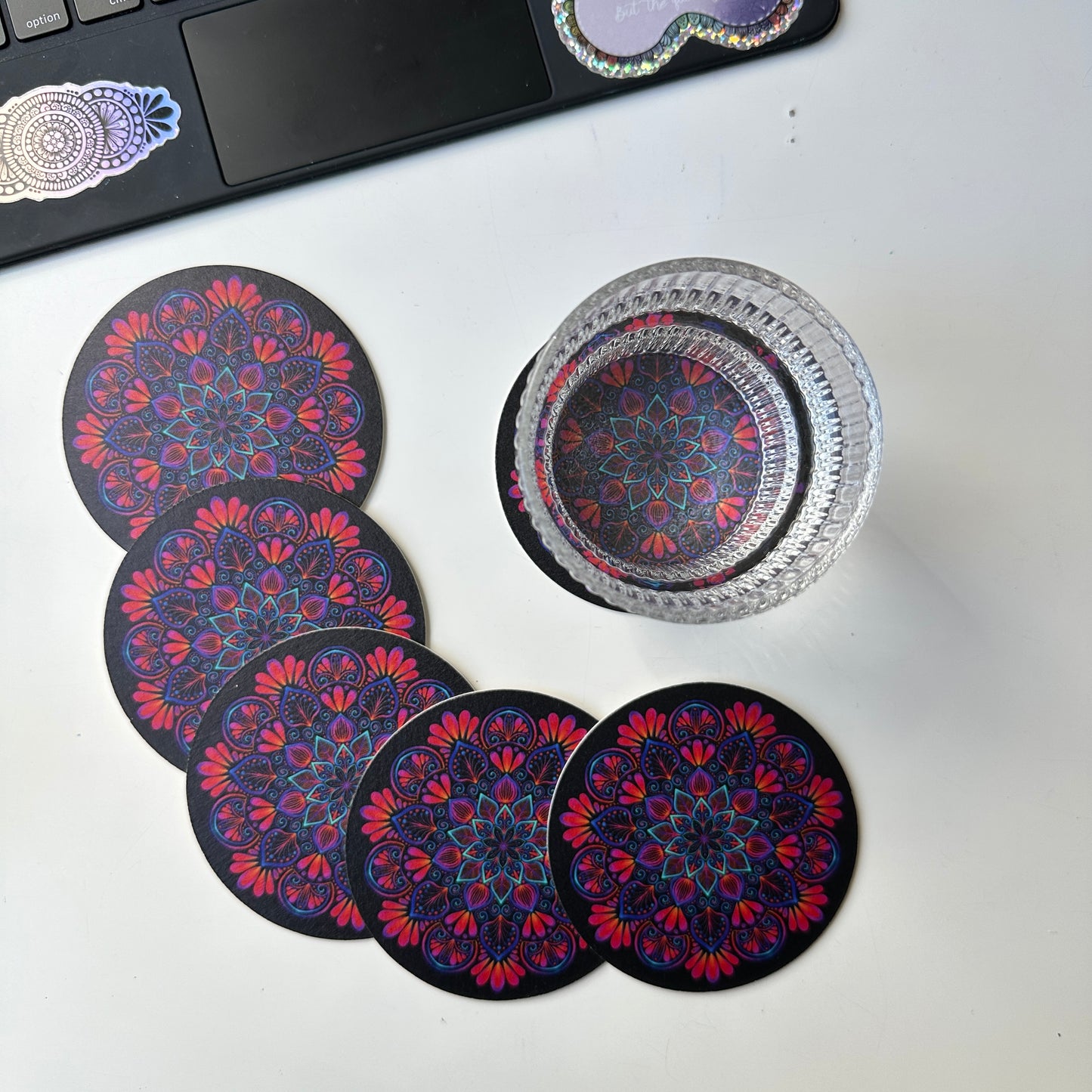 black background and colorful mandala coaster
