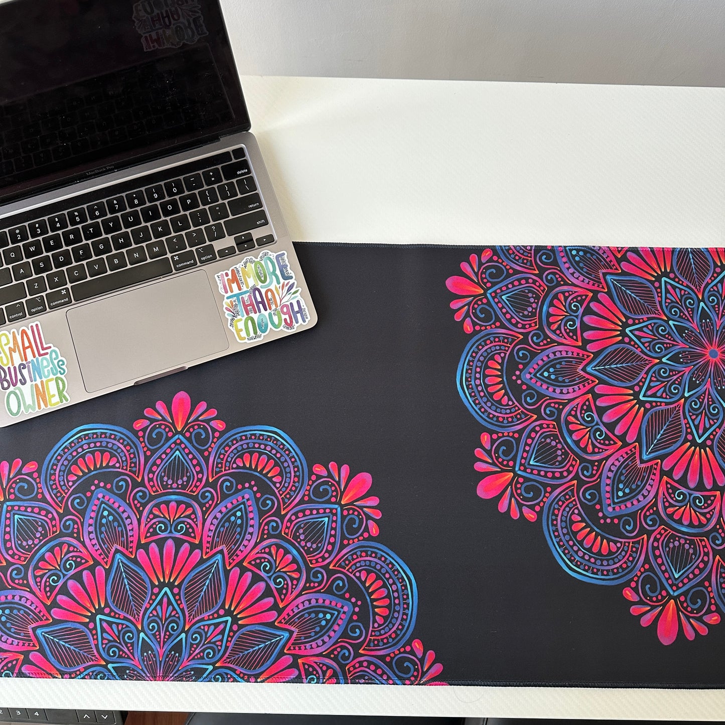 Colorful mandala with black background desk pad