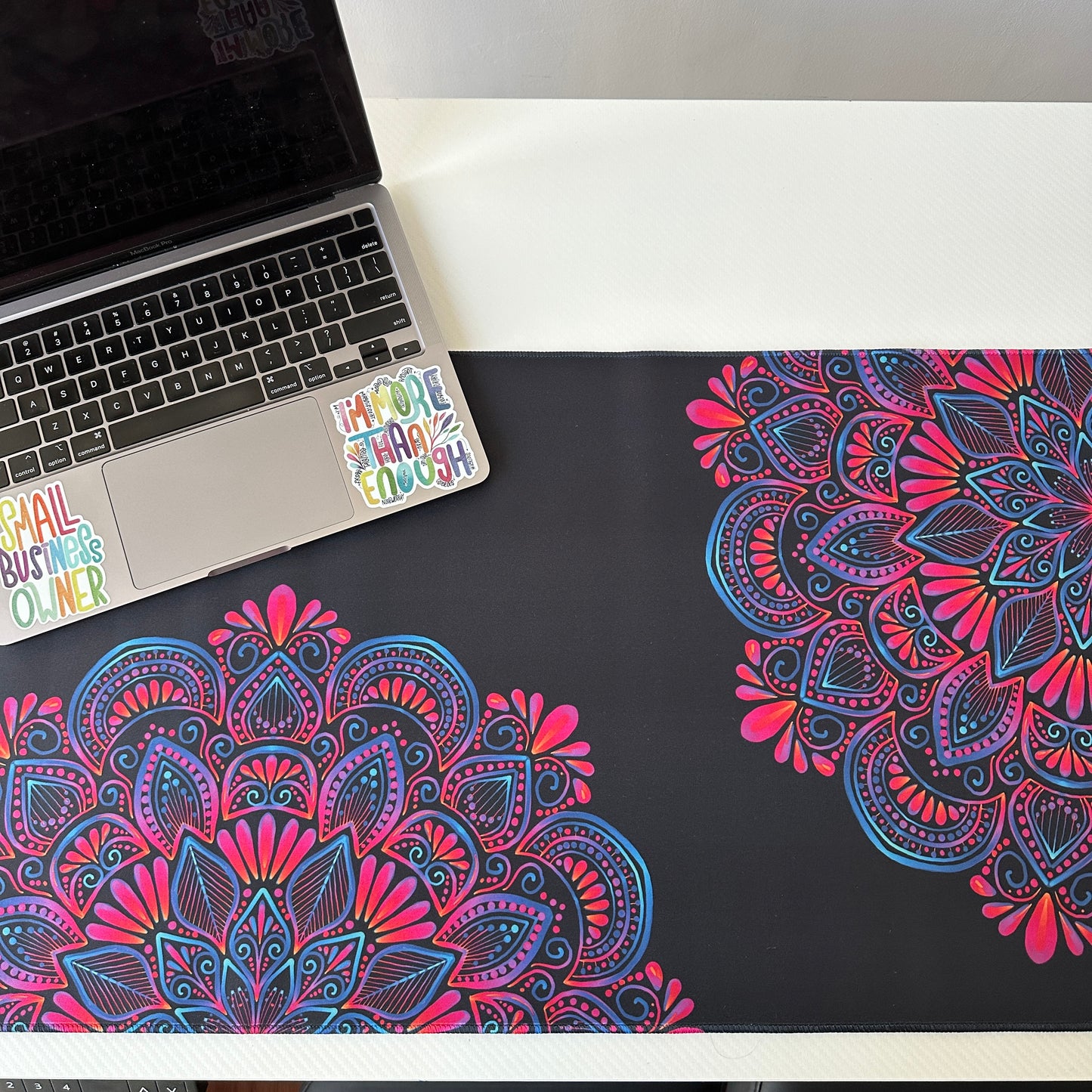 Colorful mandala with black background desk pad