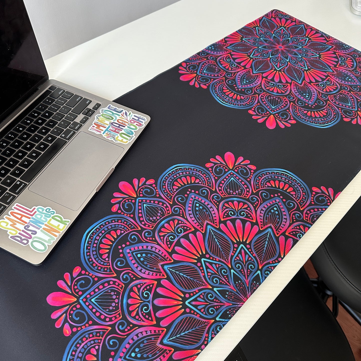 Colorful mandala with black background desk pad