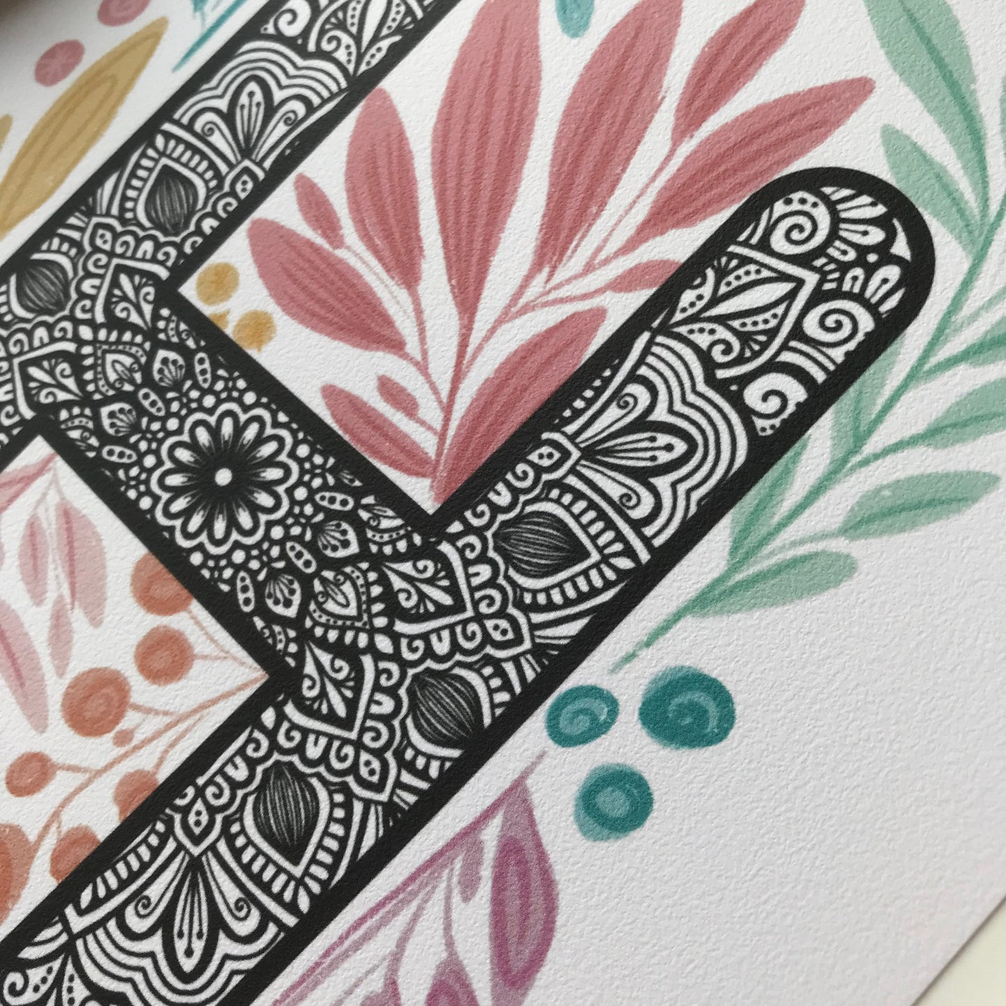 Mandala H letter with plant doodle