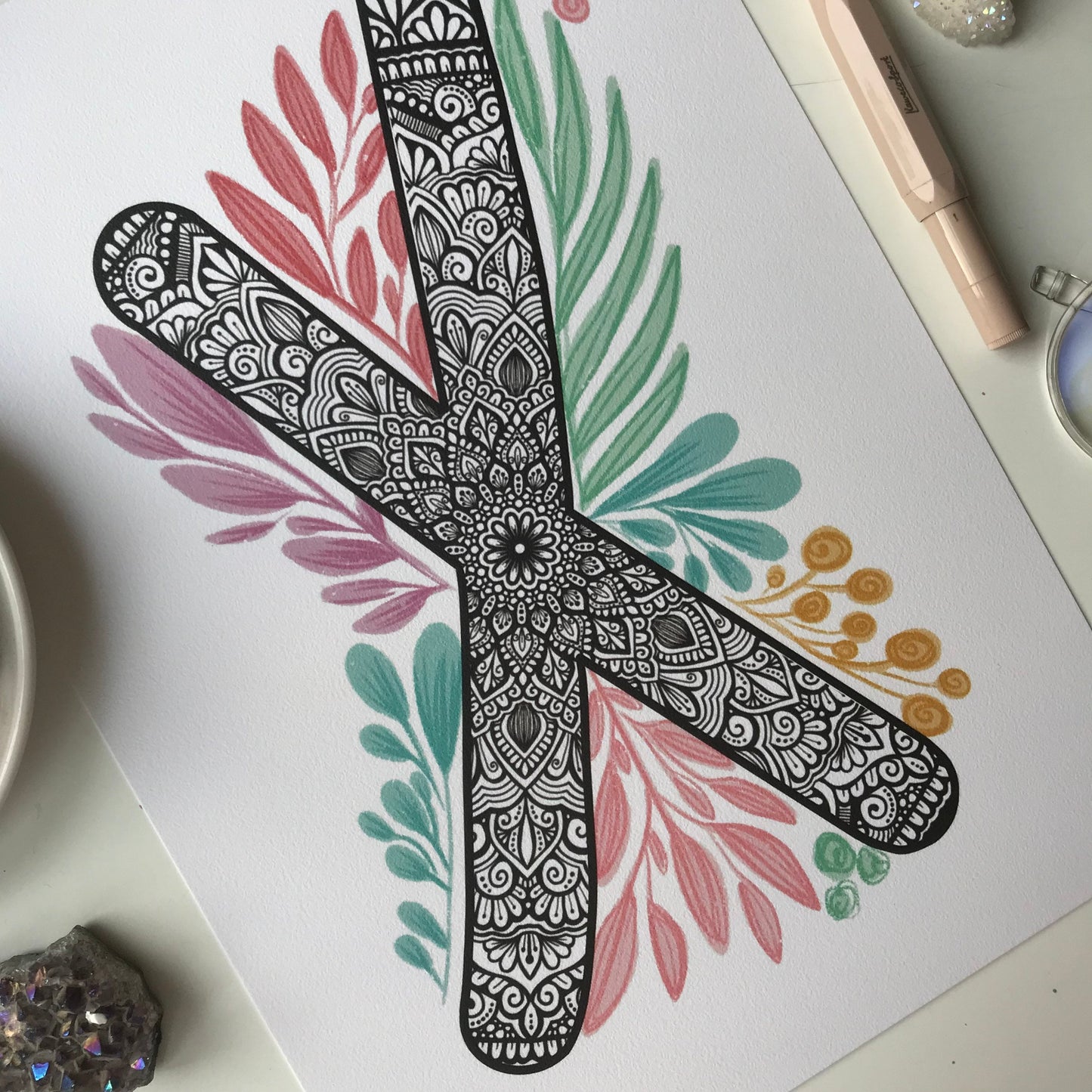 mandala X letter with plant doodle