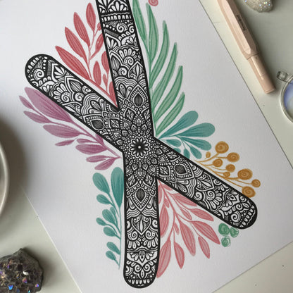 mandala X letter with plant doodle