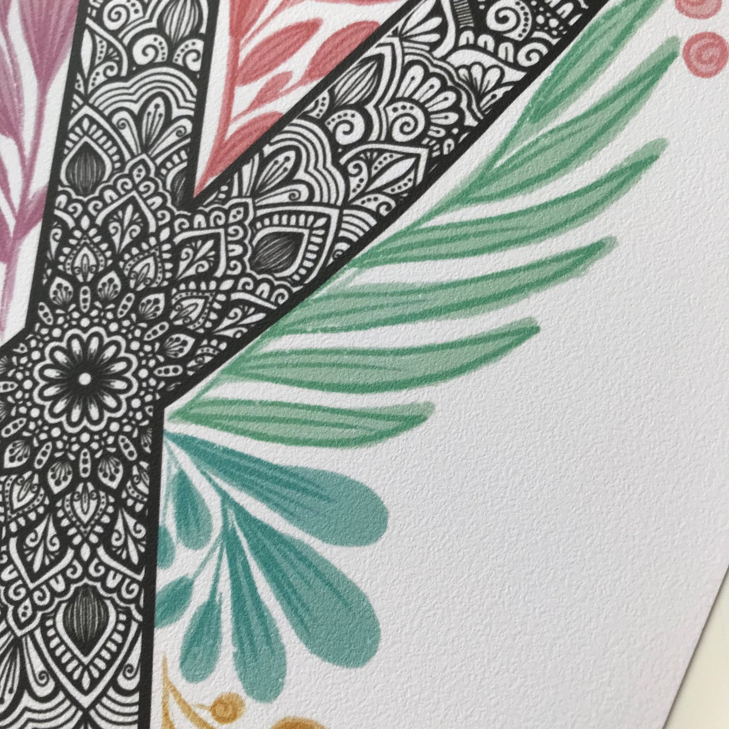 mandala X letter with plant doodle